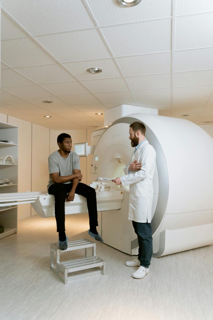 Doctor and patient discussing an MRI scan inside a medical facility.